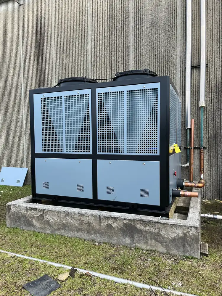 Industrial chiller set on a concrete pad