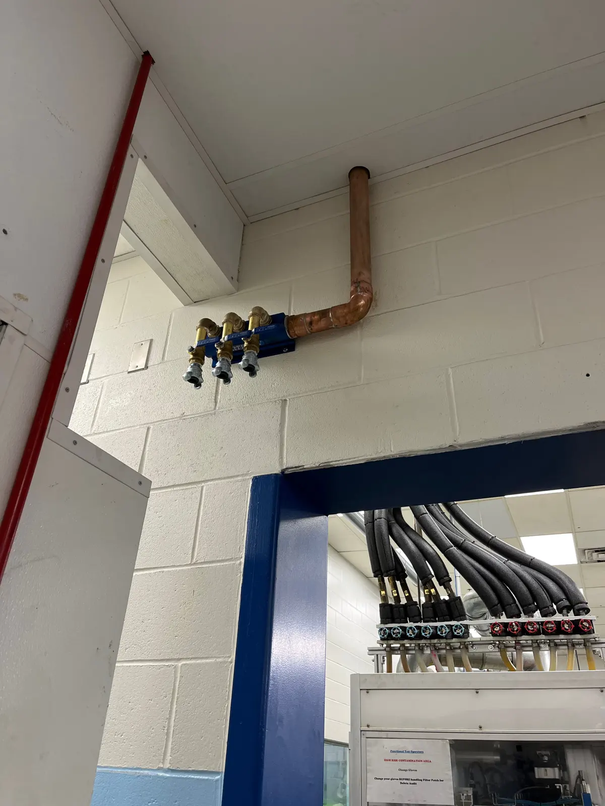 Rigid conduit and conductors feeding an industrial panel